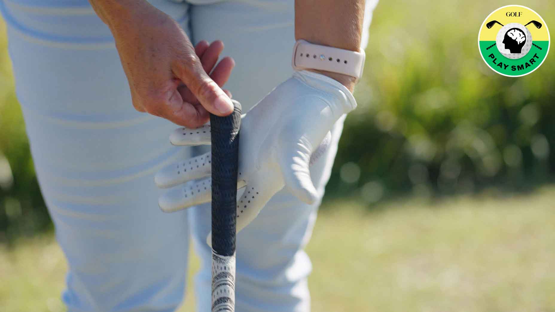 golfer wearing golf clove grips club