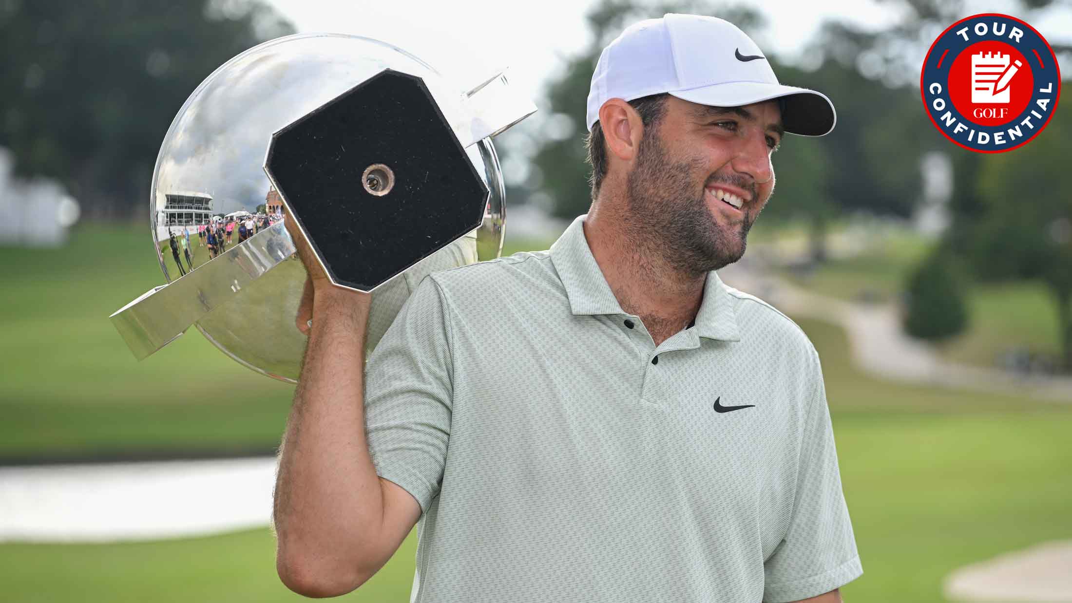 Scottie Scheffler holds the FedEx Cup trophy on the 18th green during the final round of TOUR Championship at East Lake Golf Club on September 1, 2024